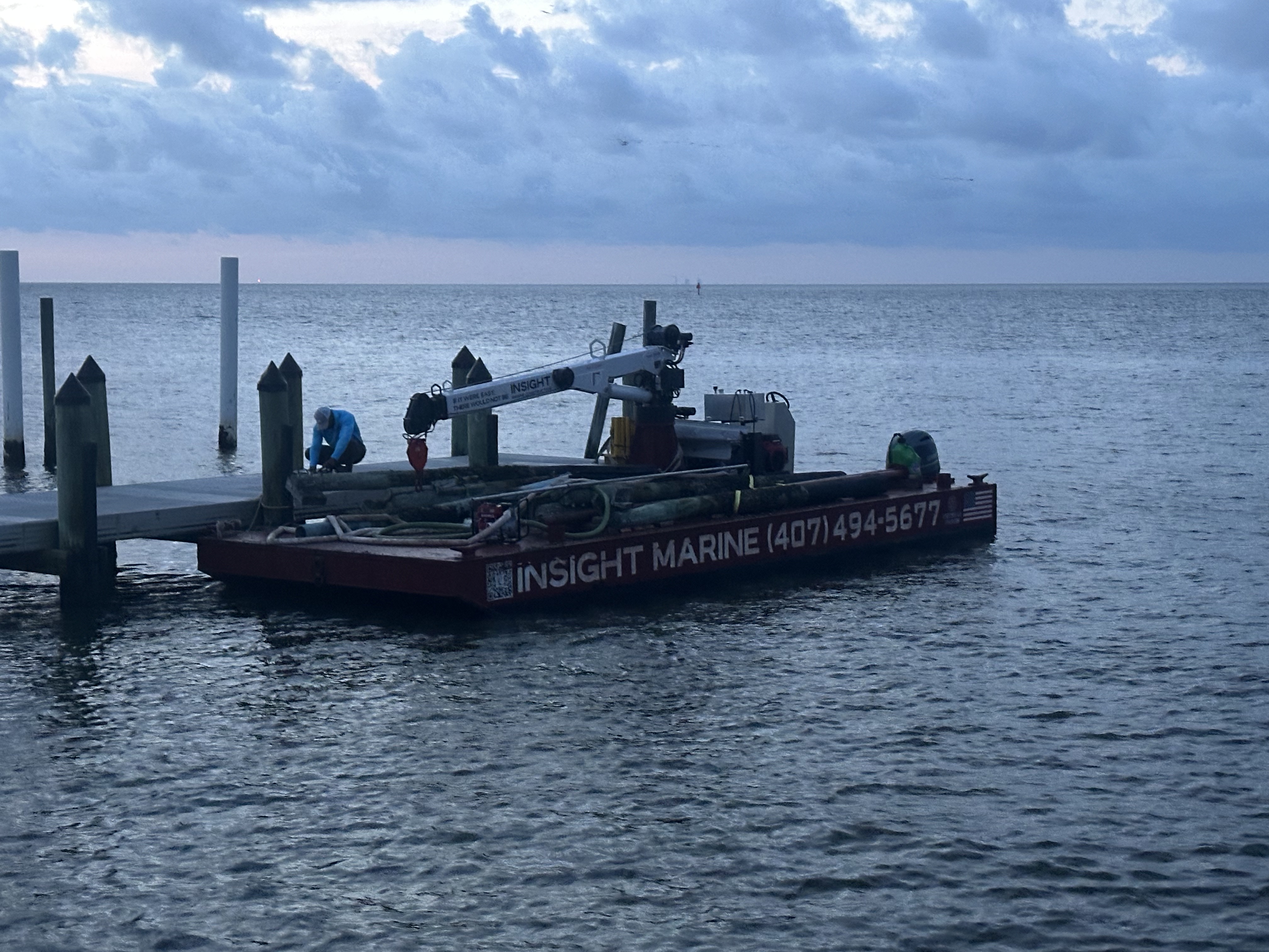 Municipal floating dock, aluminum gangway and timber piles at Cedar Key