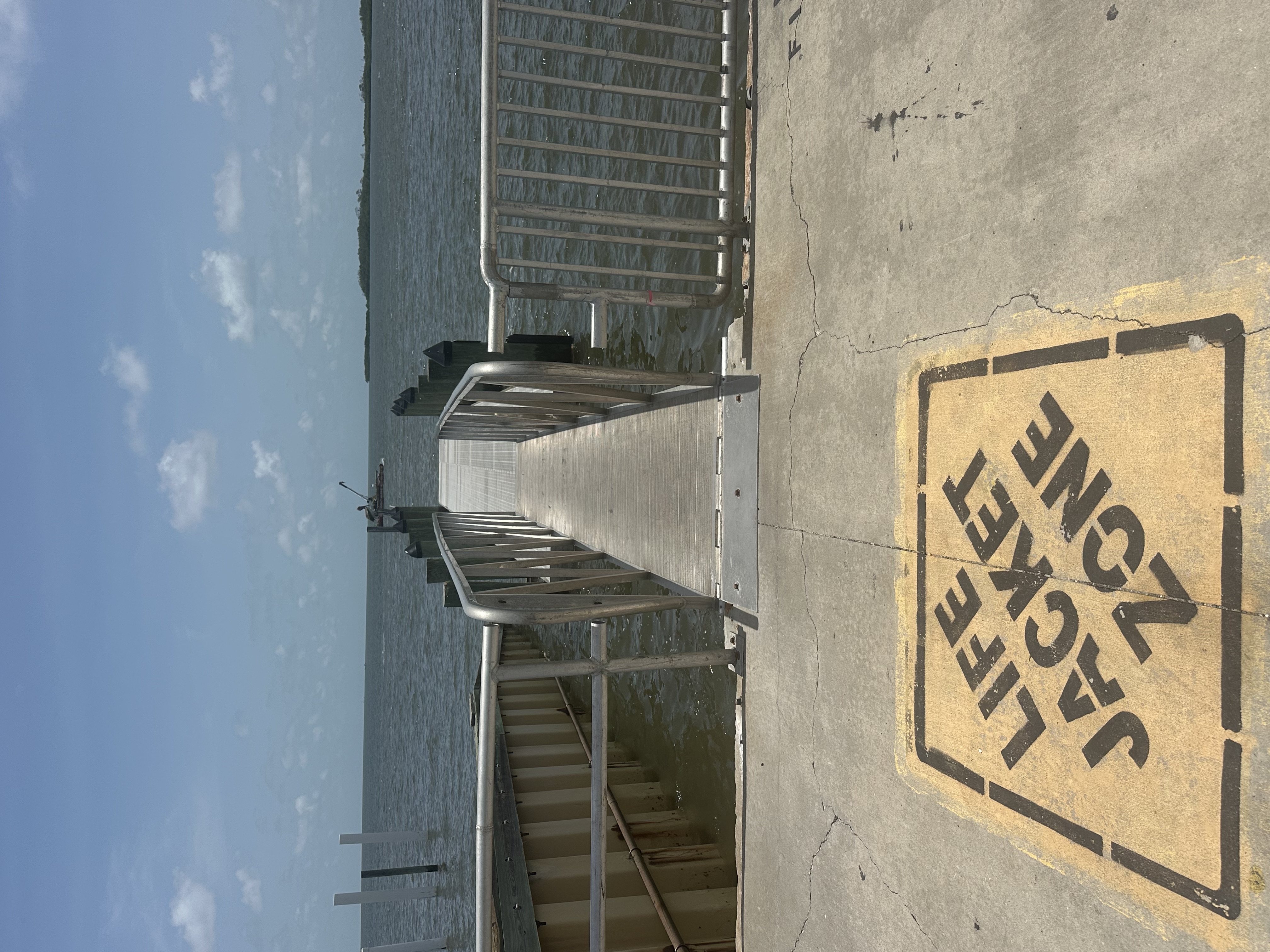 Municipal floating dock, aluminum gangway and timber piles at Cedar Key