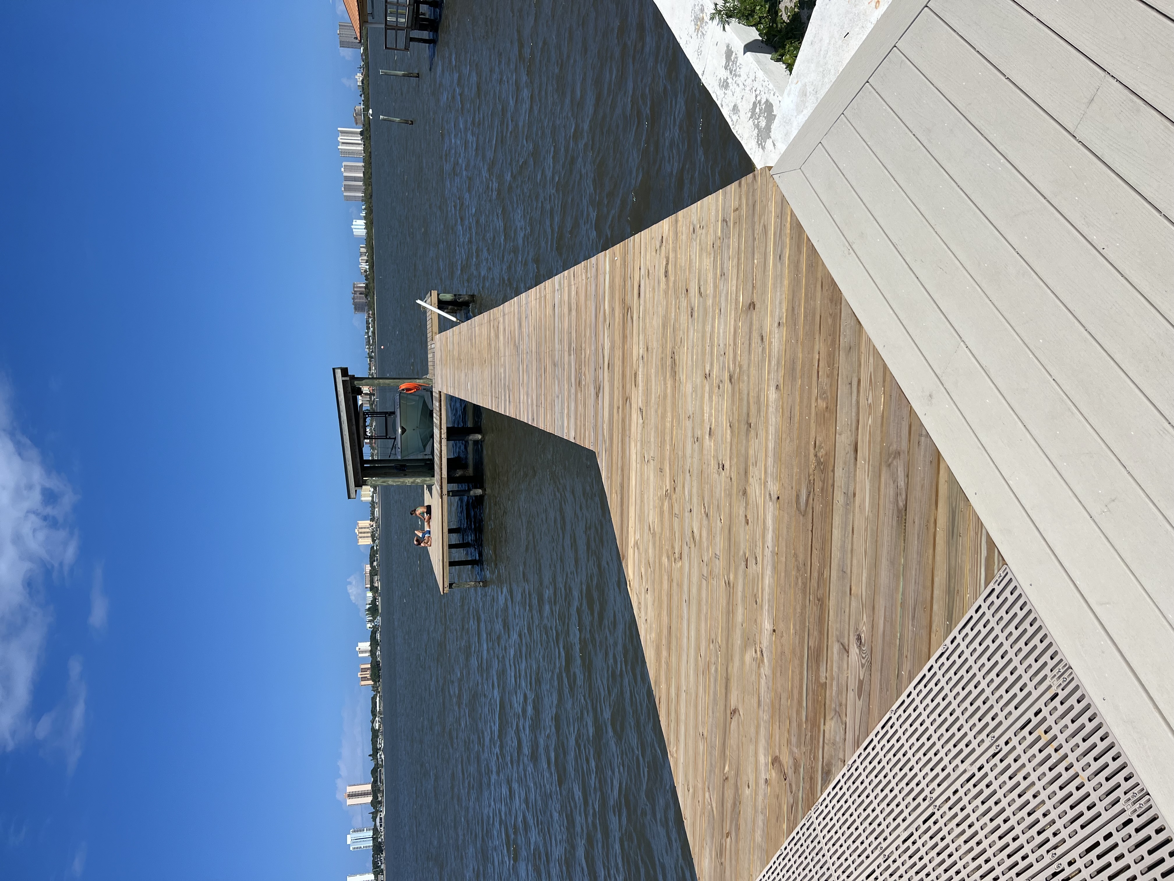 Finished timber and composite dock with a covered boat lift