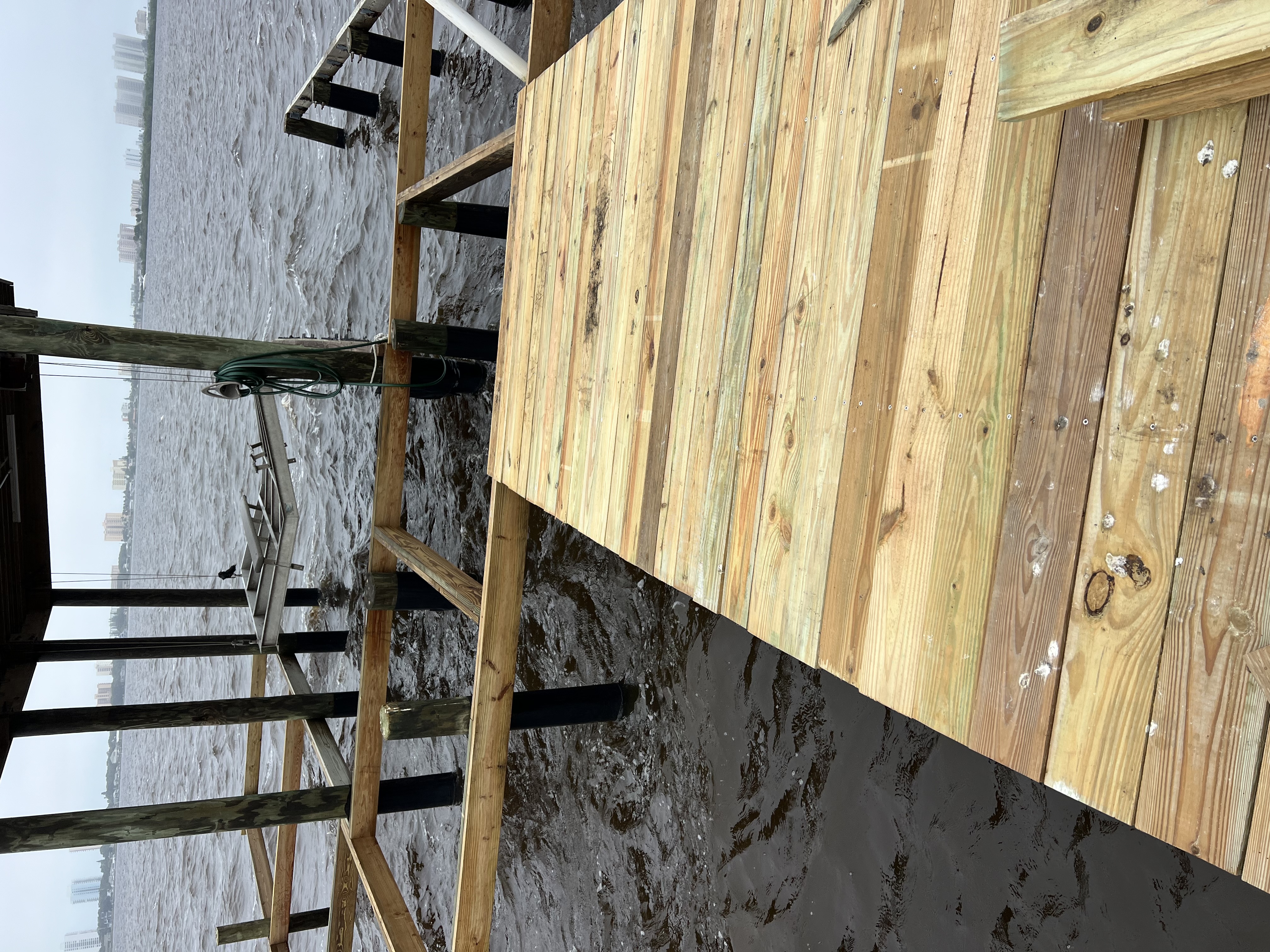 Residential dock, composite sundeck and covered boat lift on the Halifax River